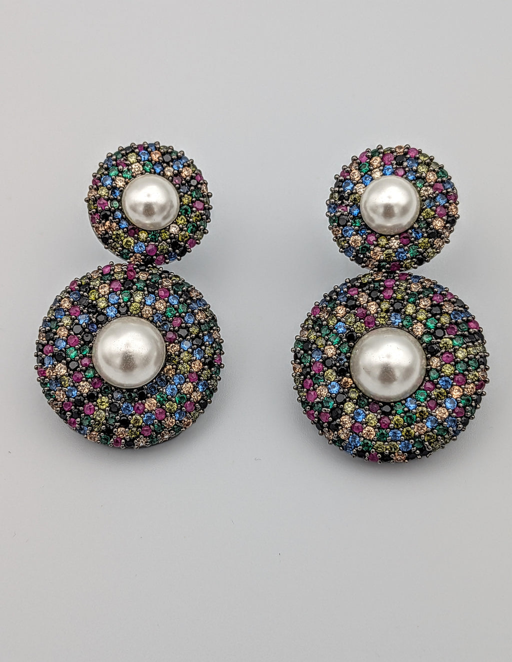 Multicolour double-disc earrings with micro stones and central pearls — vibrant festive statement earrings.