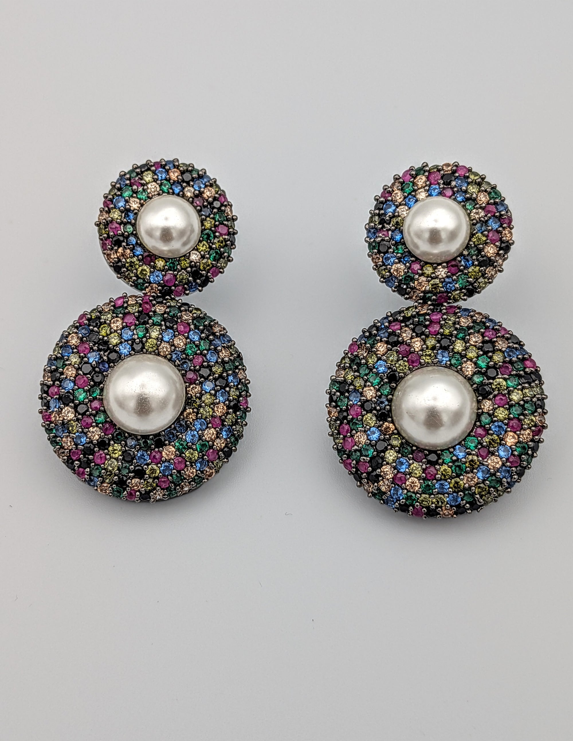 Multicolour double-disc earrings with micro stones and central pearls — vibrant festive statement earrings.