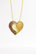 Heart-shaped gold and brown pendant