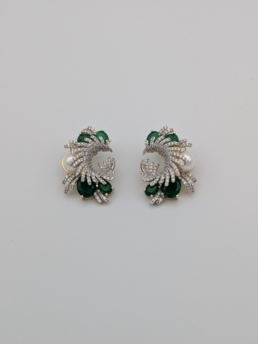 Emerald green and zircon swirl earrings with pearl accent  — premium statement earrings by TreasureDrum.