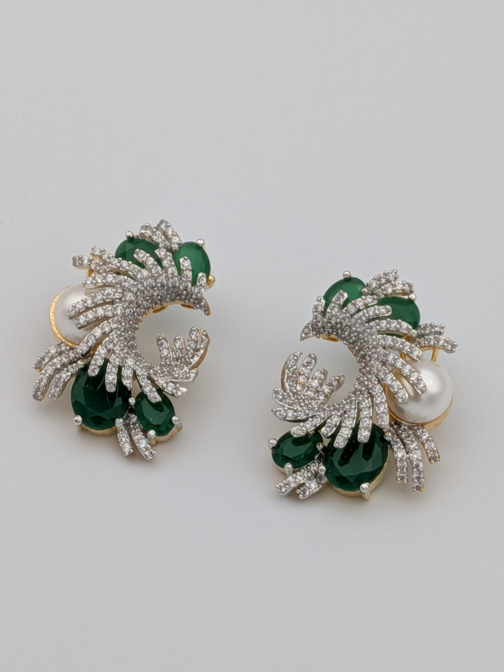 Emerald green and zircon swirl earrings with pearl accent  — premium statement earrings by TreasureDrum.