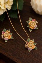 Gold necklace with floral earrings