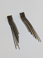 Long black crystal fringe earrings with gold detailing - modern statement earrings for party and evening wear.