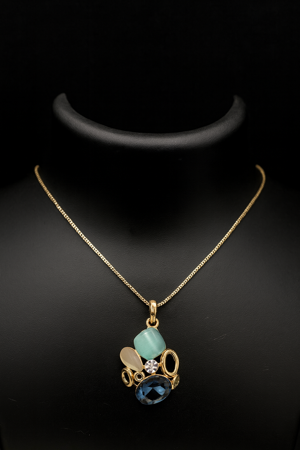 Necklace with a pendant featuring blue and green stones