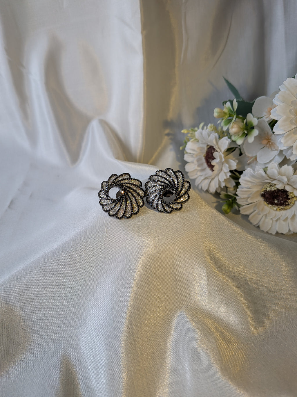 Twilight Swirl Studs – spiral gunmetal studs with black and white zirconia