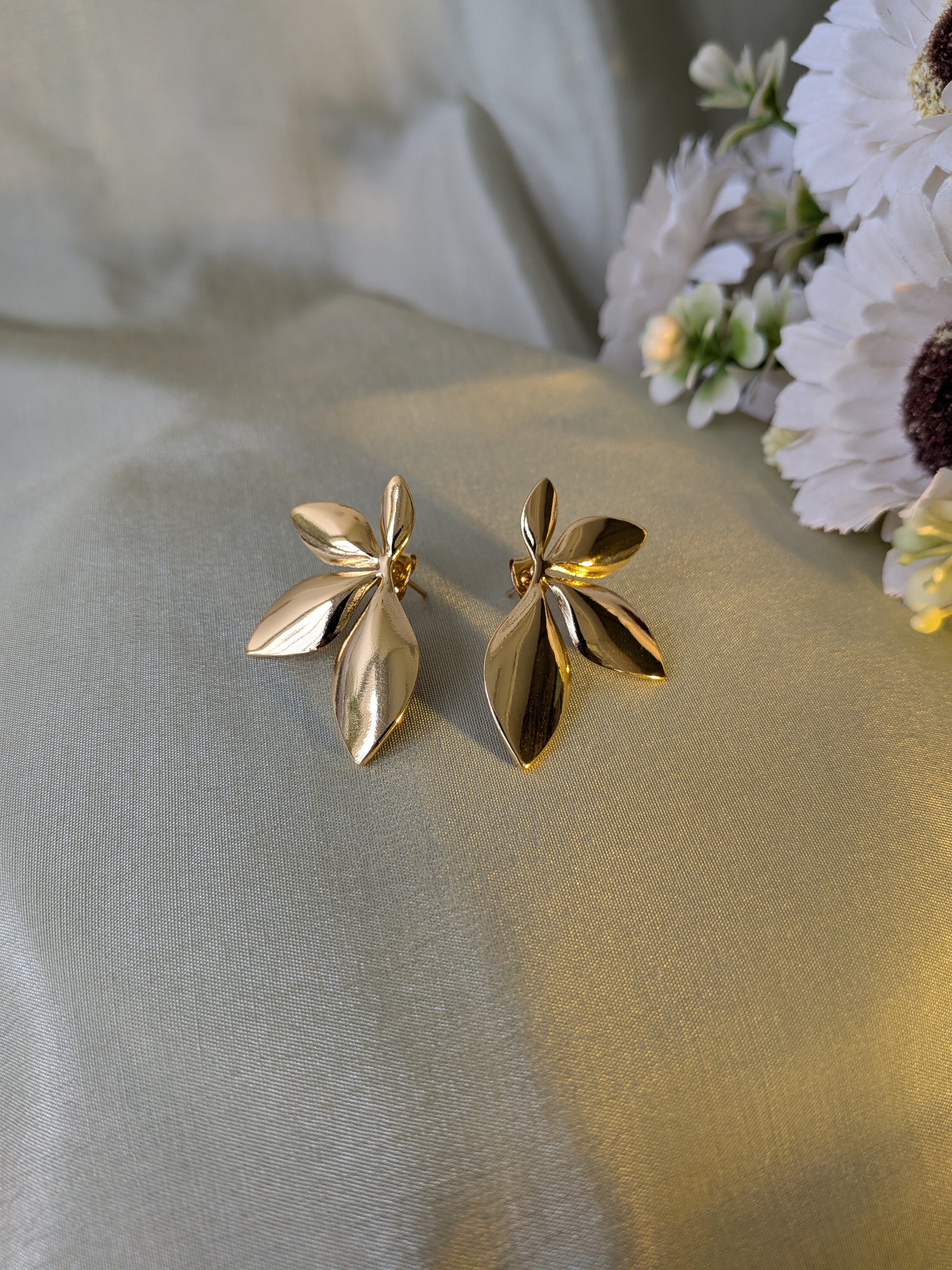 Golden Petal Drop Studs – gold petal-shaped stud earrings