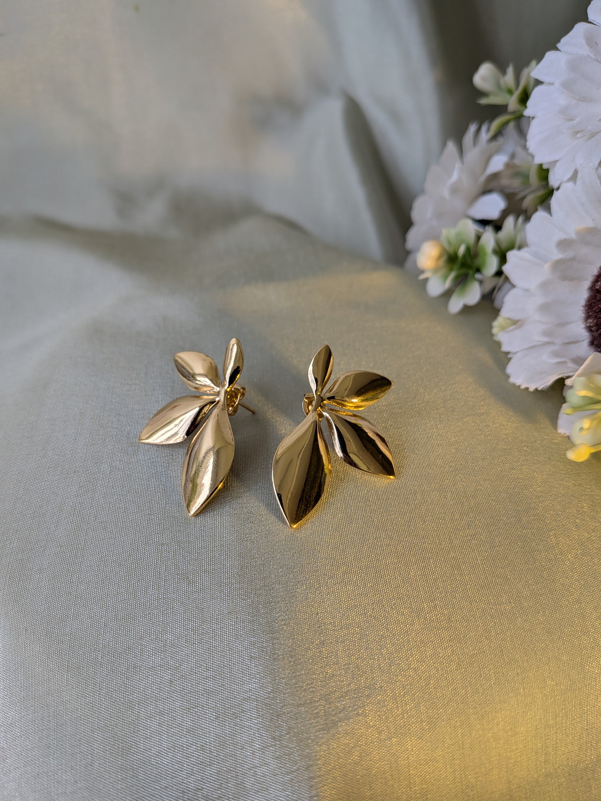 Golden Petal Drop Studs – gold petal-shaped stud earrings