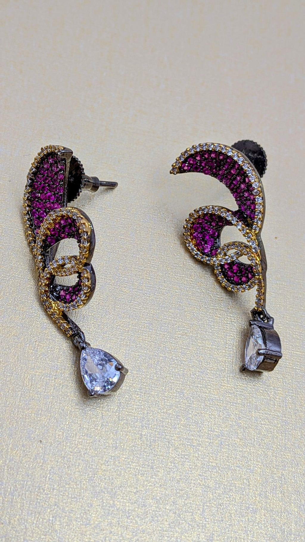 Rust Flame Swirl Drops – fiery swirl earrings with orange pavé and teardrop crystal