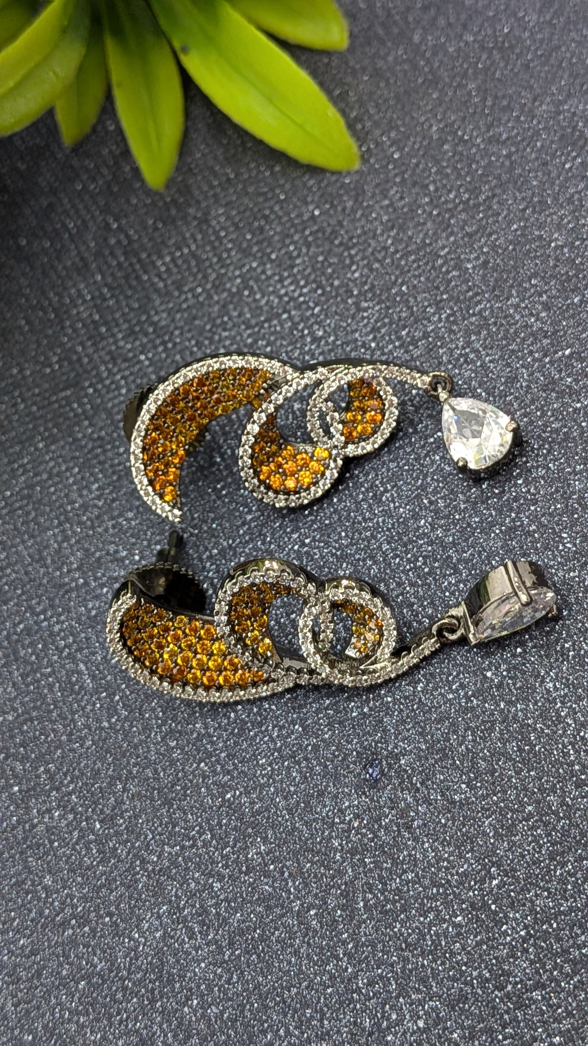 Rust Flame Swirl Drops – fiery swirl earrings with orange pavé and teardrop crystal