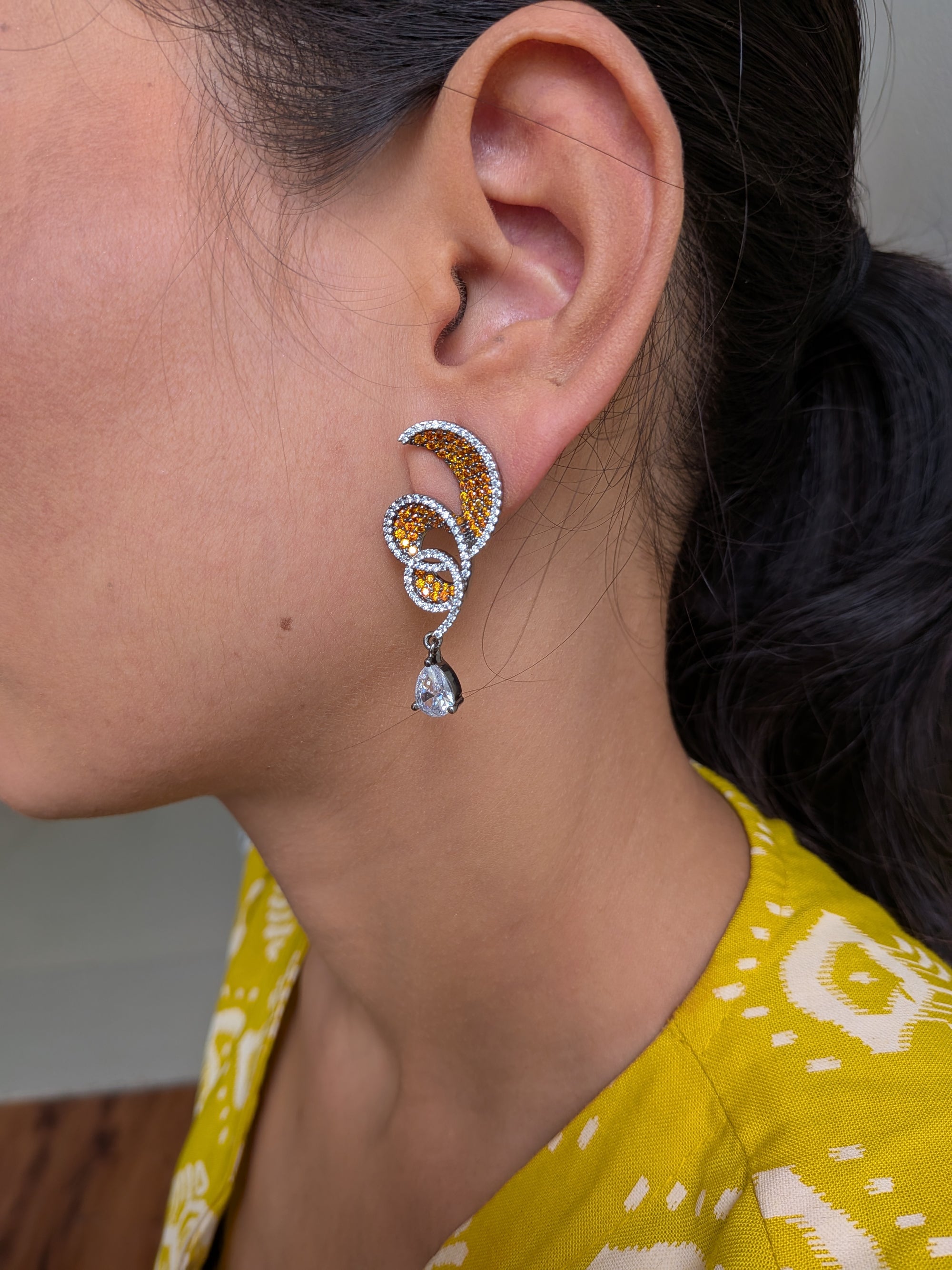 Rust Flame Swirl Drops – fiery swirl earrings with orange pavé and teardrop crystal