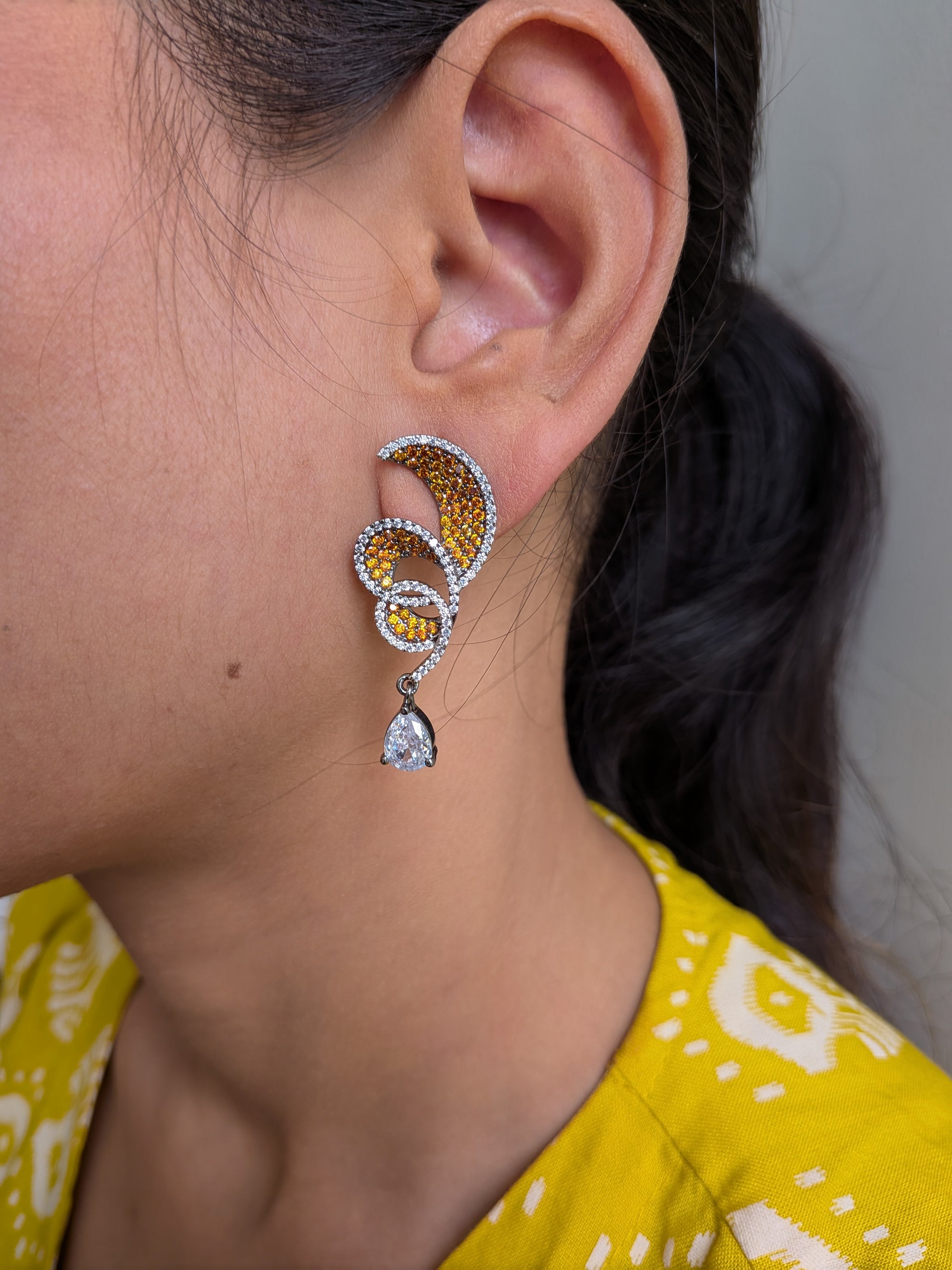 Rust Flame Swirl Drops – fiery swirl earrings with orange pavé and teardrop crystal