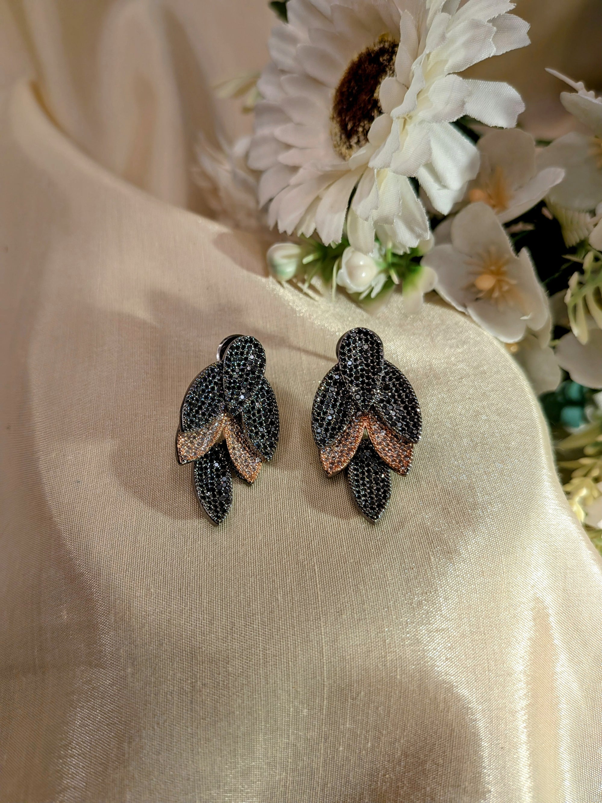 Rosélure Pavé Leaf Earrings – cascading leaf earrings with pink and ruby pavé