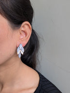 Rosélure Pavé Leaf Earrings – cascading leaf earrings with pink and ruby pavé