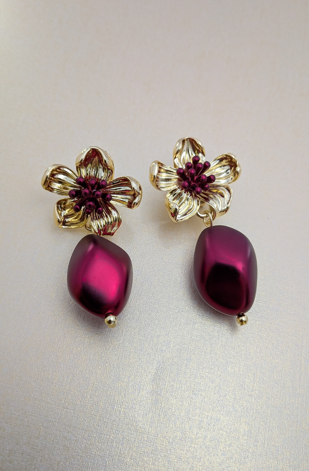 BloomBerry Drop Earrings – gold floral earrings with rich berry-tone matte drops