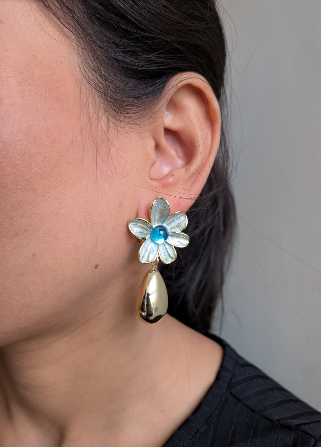 AzurePetal Bloom Drops – pearlescent petal earrings with blue gem and gold-tone droplet charms