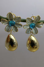 AzurePetal Bloom Drops – pearlescent petal earrings with blue gem and gold-tone droplet charms