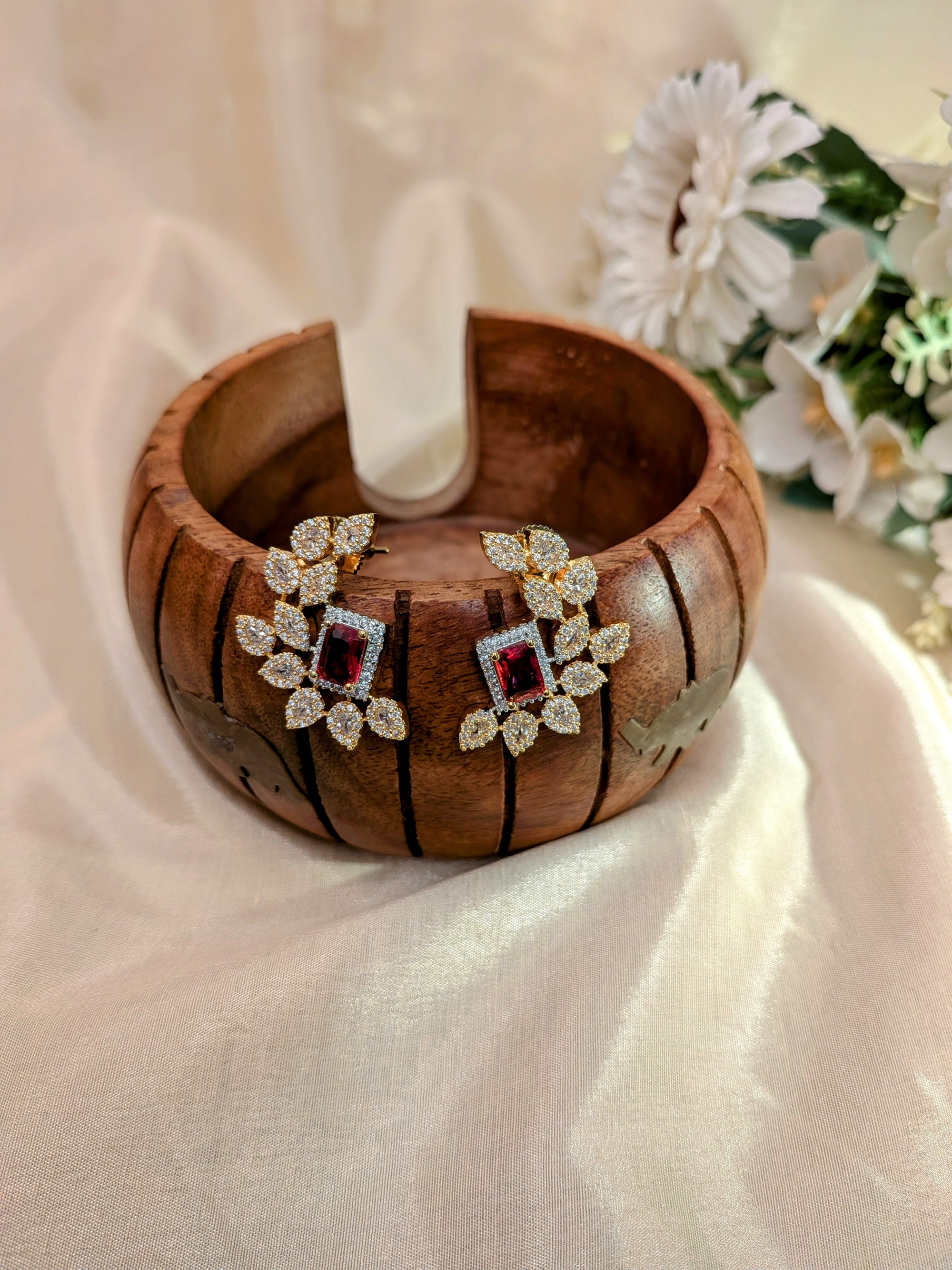 Regalia Bloom Studs – emerald-cut white stone stud surrounded by zirconia halo in gold setting