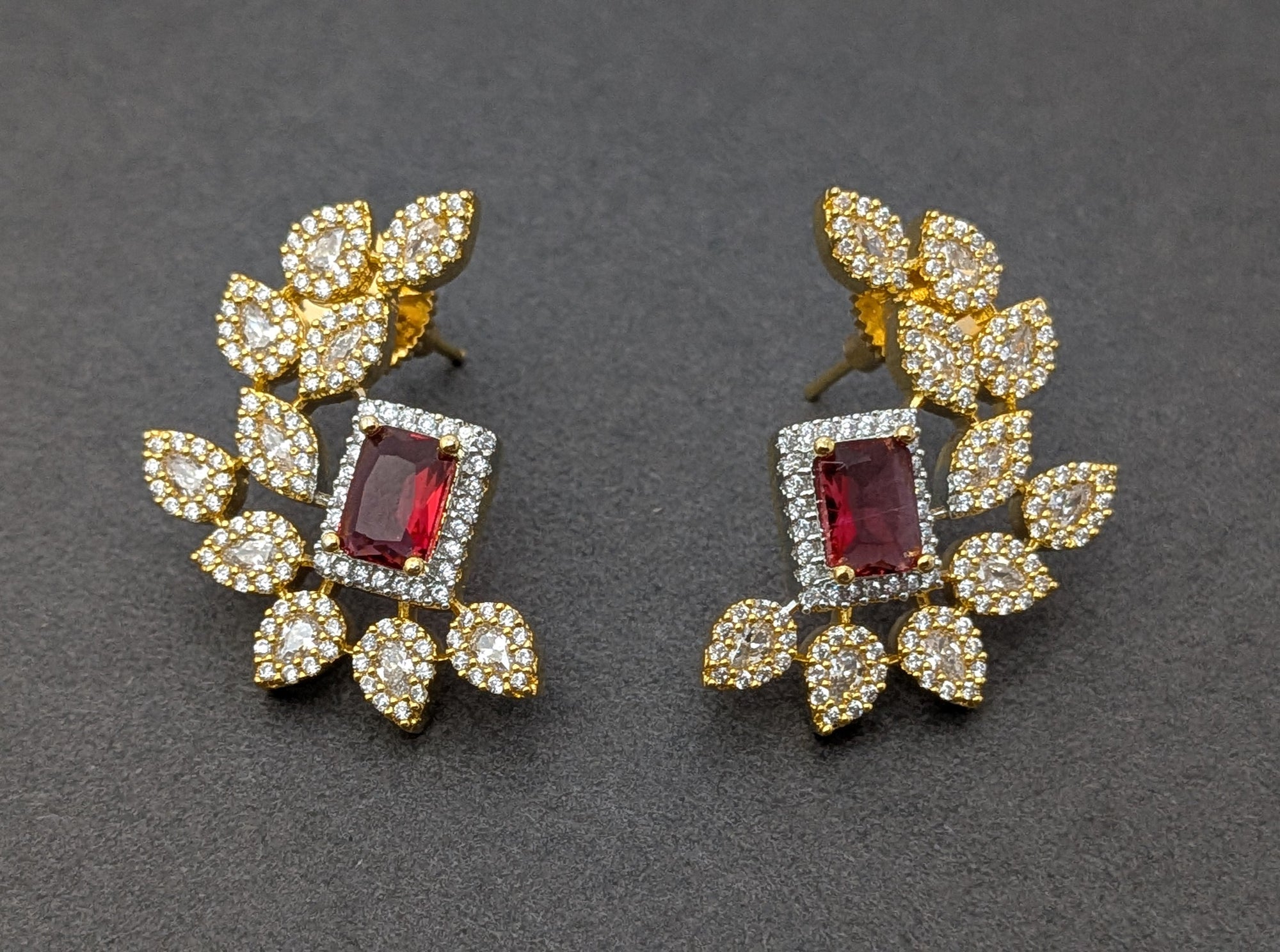 Regalia Bloom Studs – emerald-cut white stone stud surrounded by zirconia halo in gold setting