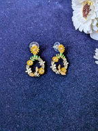 Blossom Buzz Earrings – hoop earrings with yellow daisies, white flowers and bee motifs
