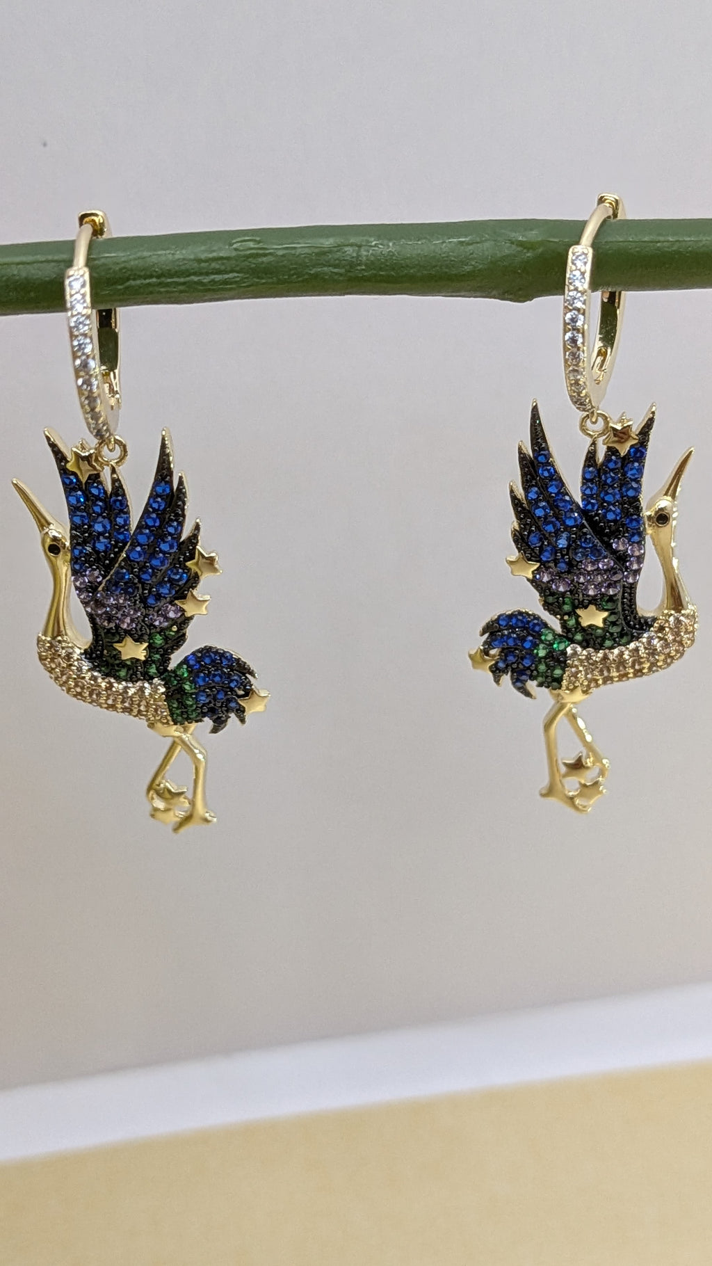 Celestia Flight Earrings – bird-shaped earrings in sapphire, emerald and crystal stones with zircon hoop