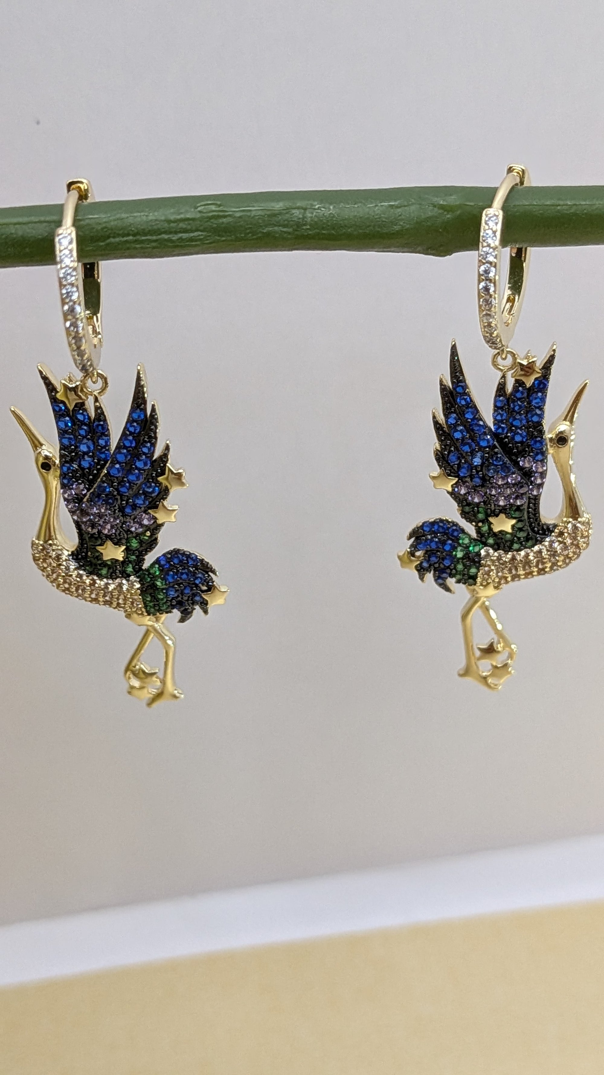 Celestia Flight Earrings – bird-shaped earrings in sapphire, emerald and crystal stones with zircon hoop