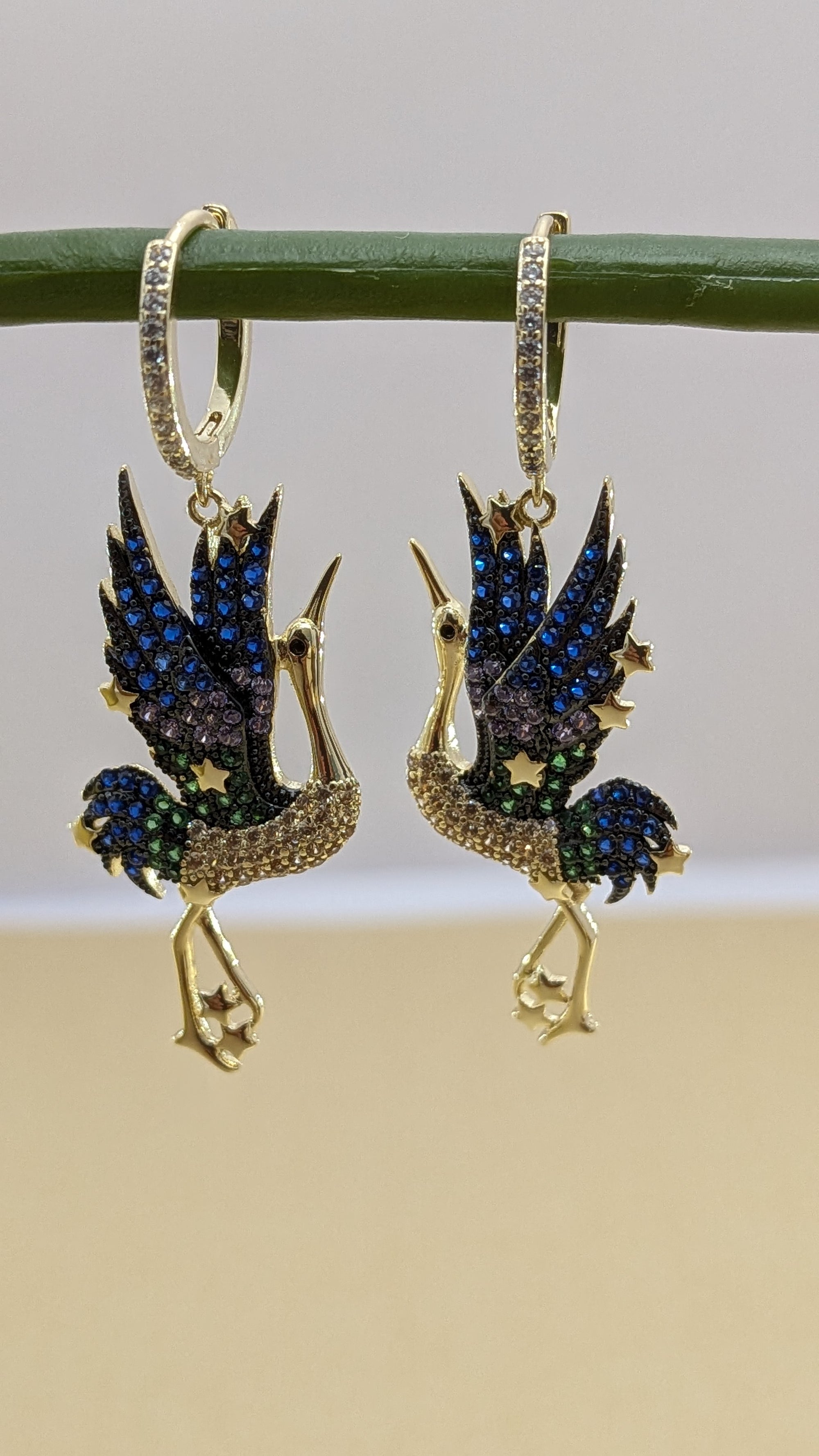 Celestia Flight Earrings – bird-shaped earrings in sapphire, emerald and crystal stones with zircon hoop
