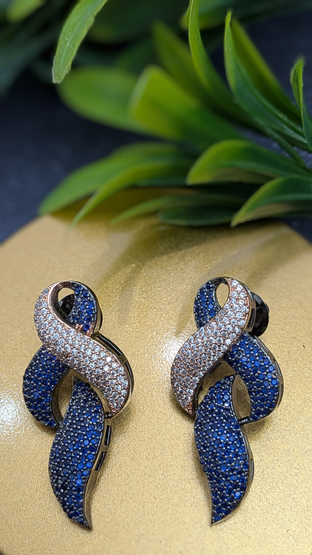 Sapphire Drift Earrings – fluid swirl of sapphire blue and white stones