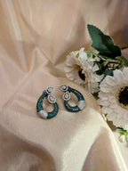 Emerald Grace Studs – emerald-toned teardrop with pavé crystals and pear-shaped tops