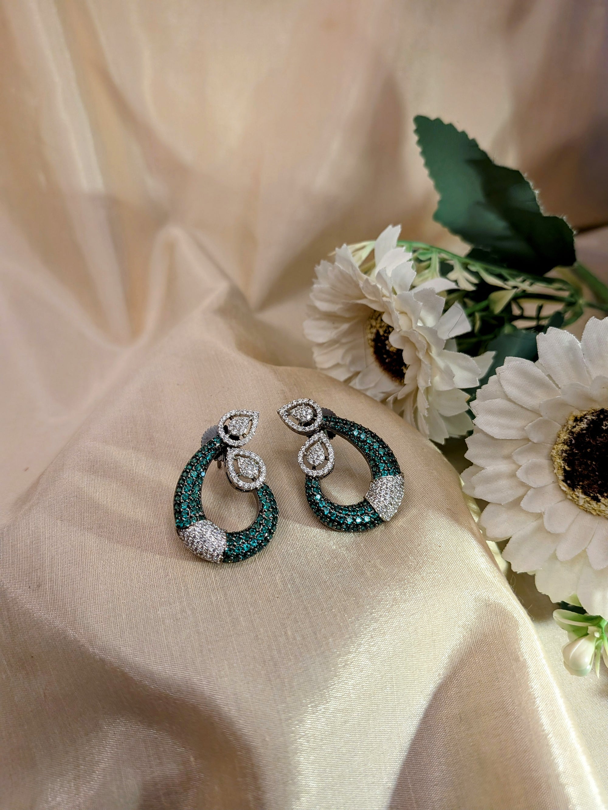 Emerald Grace Studs – emerald-toned teardrop with pavé crystals and pear-shaped tops