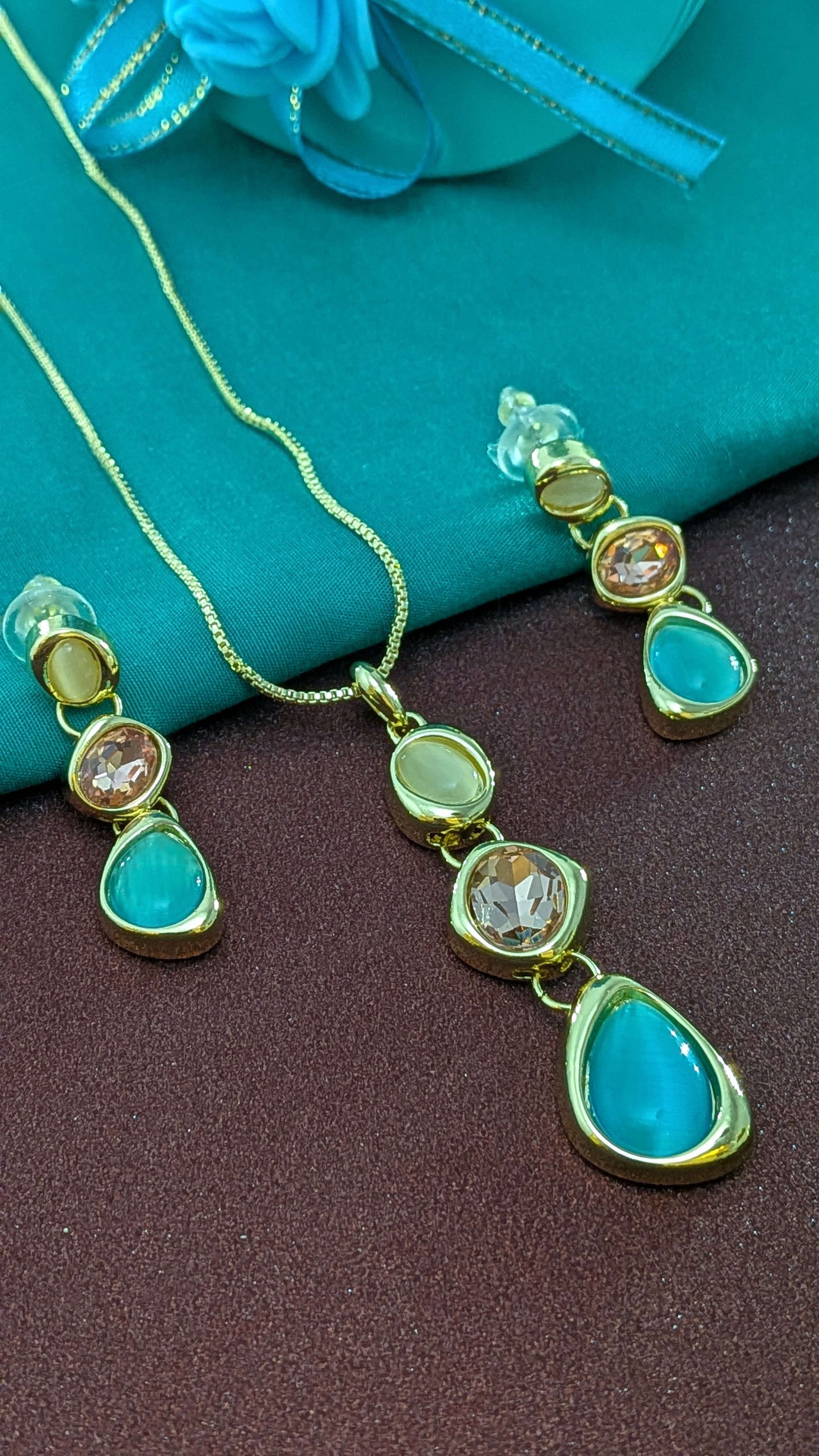 Ocean Glow Pendant Set – cascading pearl, peach, and sea-green stones in gold