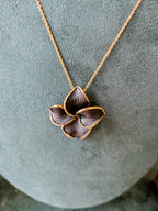 Midnight Bloom Pendant Set – black enamel floral design with gold outline