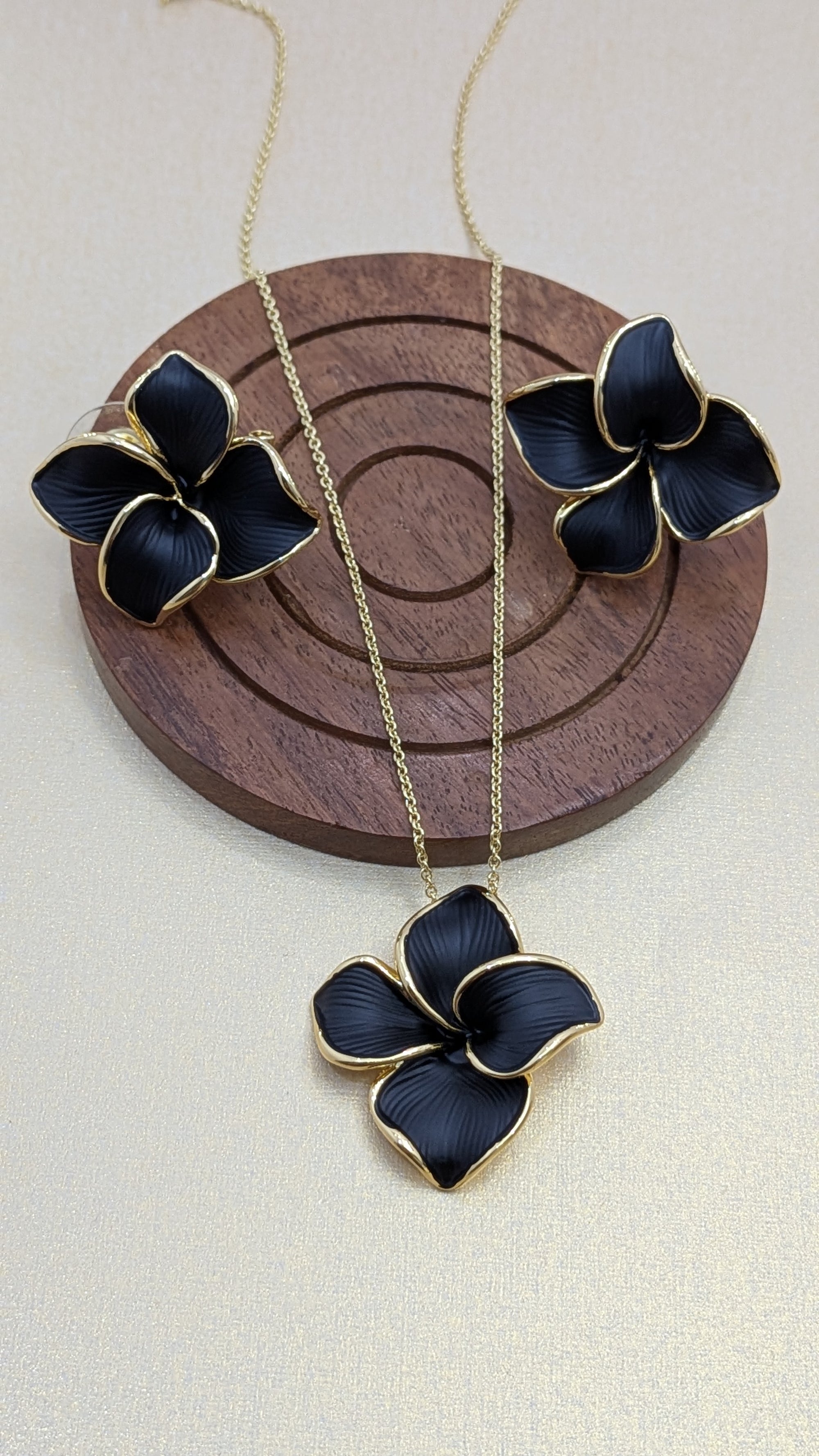 Midnight Bloom Pendant Set – black enamel floral design with gold outline