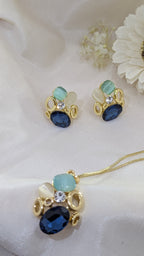 Ocean Whisper Pendant Set – blue, white and sapphire stones in gold frames