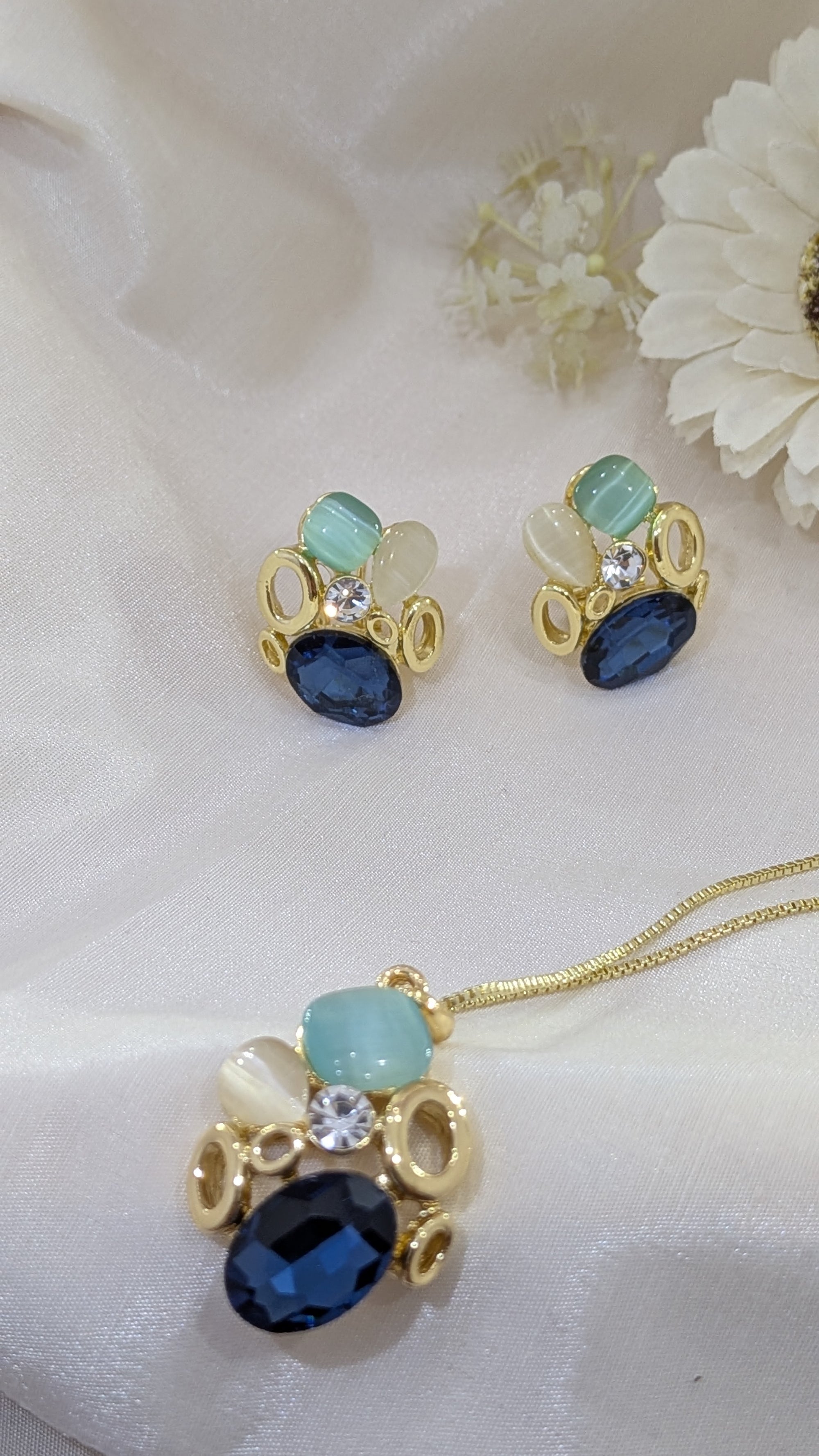 Ocean Whisper Pendant Set – blue, white and sapphire stones in gold frames