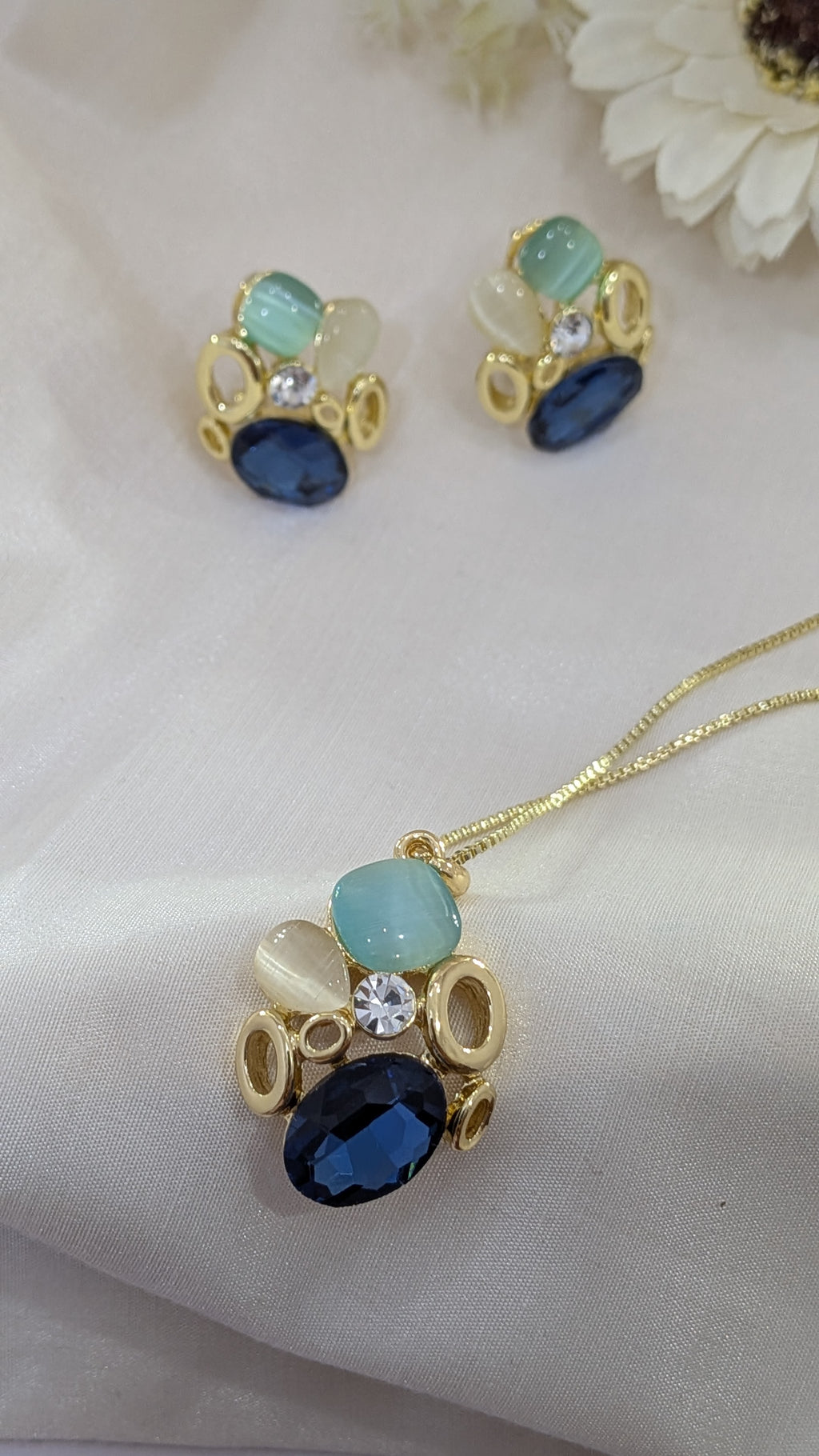 Ocean Whisper Pendant Set – blue, white and sapphire stones in gold frames