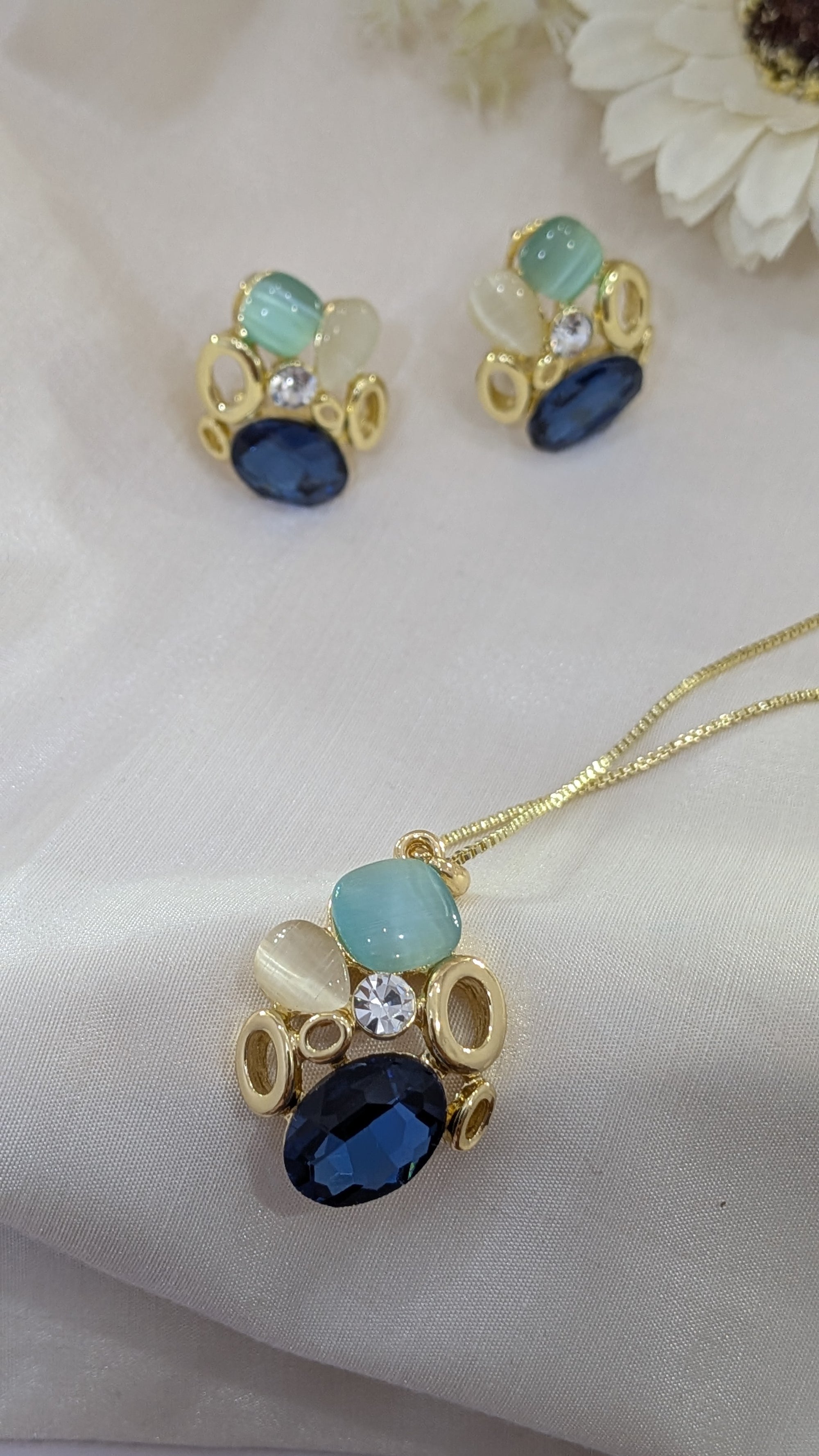 Ocean Whisper Pendant Set – blue, white and sapphire stones in gold frames