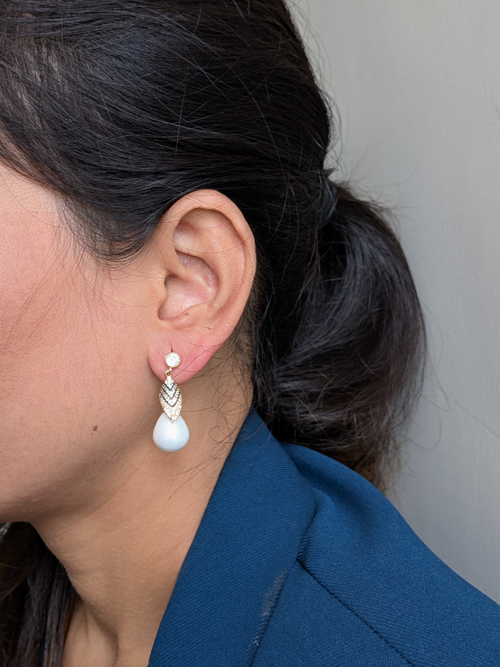 Royal Gleam Pearl Drops – crystal stud earrings with chevron zirconia and glossy teardrop pearls