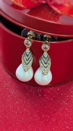 Royal Gleam Pearl Drops – crystal stud earrings with chevron zirconia and glossy teardrop pearls