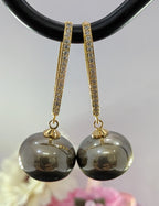 Gleam & Grace Hoops – gold zircon-encrusted hoop earrings with high-shine pearl drops