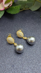 Twilight Pearl Drops – pave-set tops with teardrop grey pearls and connector stone