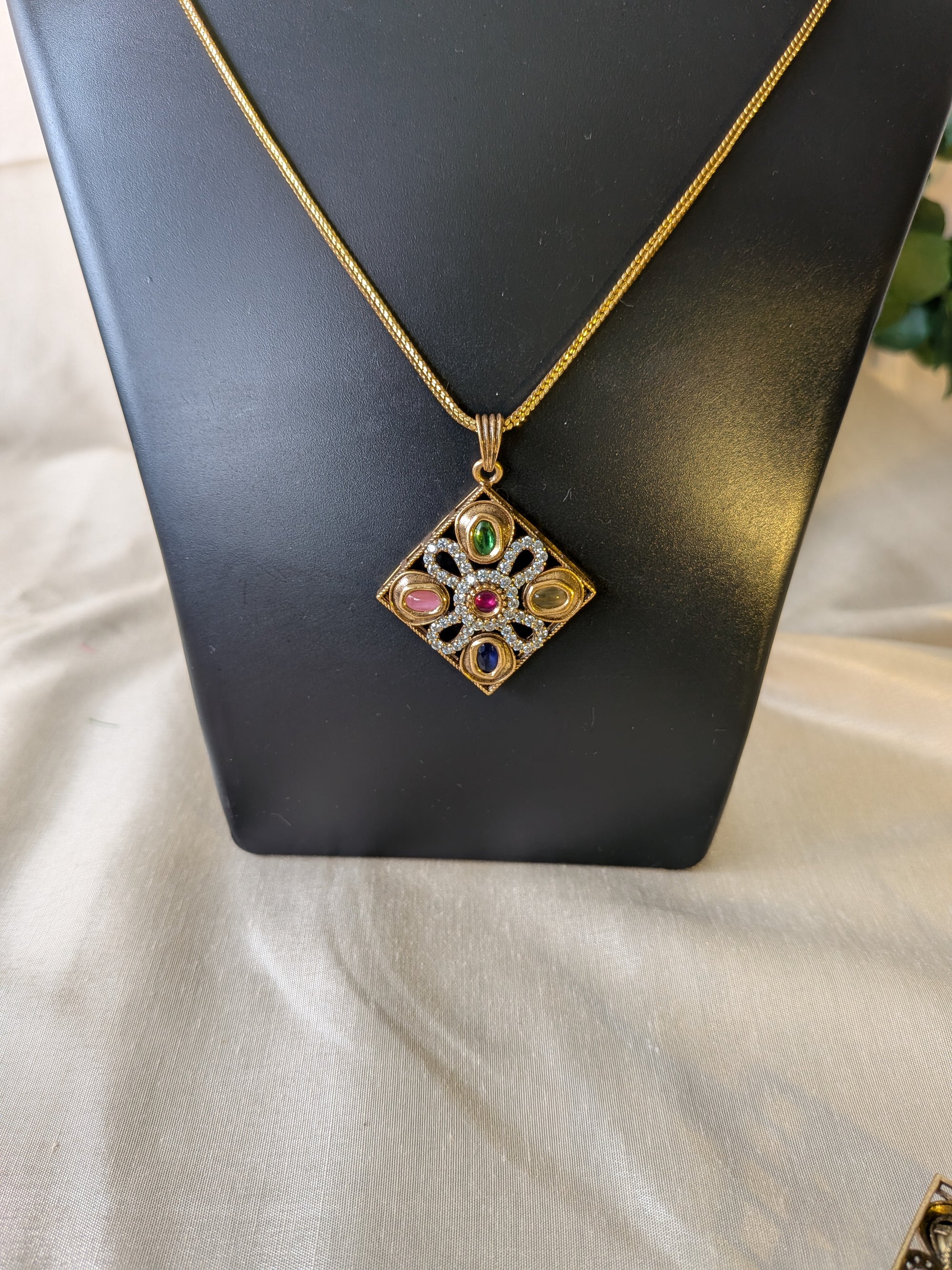 Navratna Harmony  pendant set from TreasureDrum Jewellery